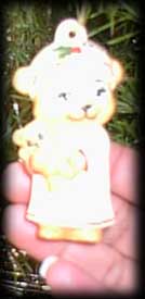 Bear in nightgown with teddy bear ornament